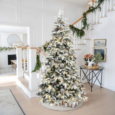 Image showing  7 ft. Pre-Lit Flocked Artificial Pine Christmas Tree with Pinecones and Metal Stand