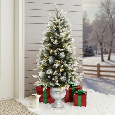 Image showing  4.5 ft. Pre-Lit Green Artificial Christmas Tree with Light Faux Snow and White Pot