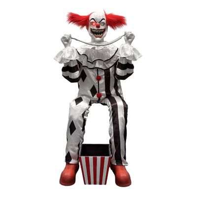 Haunted Hill Farm 4 ft. 1 in. Motion Activated Red Green LED Animatronic Sitting Scareclown with Saw & Candy