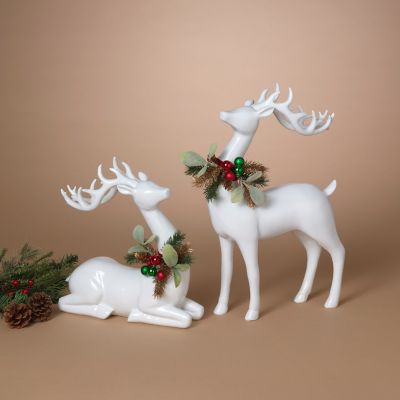 Gerson International Resin Holiday Deer with Floral Accent 11.4 in. H/7.6 in. L, Set of 2