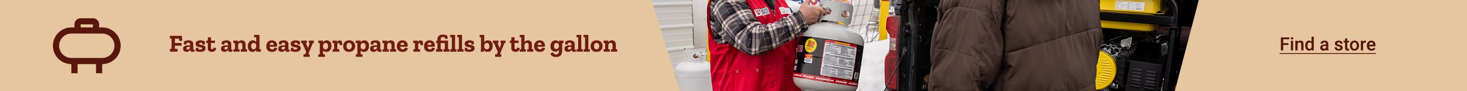 A TSC sales person holding a propane tank