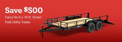 Save $500 on the Carry-On 6 x 14 ft. Smart Fold Utility Trailer. Image shows a black tandem-axle utility trailer with a wood deck, folding ramp gate, and side rails.