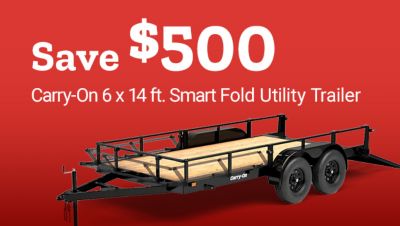 Save $500 on the Carry-On 6 x 14 ft. Smart Fold Utility Trailer. Image shows a black tandem-axle utility trailer with a wood deck, folding ramp gate, and side rails.