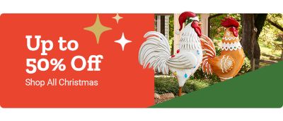 Promotional banner showing up to 50 percent off Christmas items. The image features two large decorative Christmas roosters placed outdoors near a house, along with festive star accents and a Shop All Christmas callout.